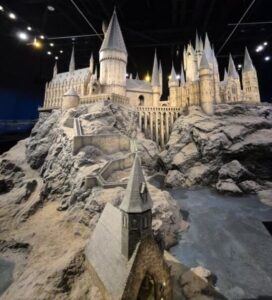 Detailed model of Hogwarts castle on a rocky landscape.