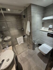 Sleek bathroom with contemporary fixtures and a spacious shower area.