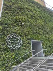 A Sky Garden sign and garden like exterior on the building.