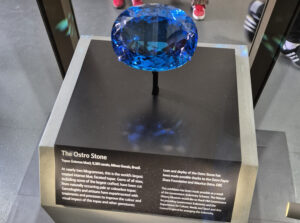 The Ostro Stone: A 9,381-carat intense blue topaz gemstone from the Vault Collection, displayed in the Natural History Museum.