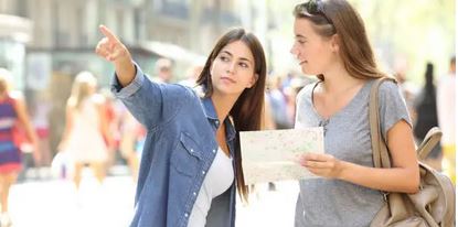 A person showing directions to another person. A great way to get local travel advice.