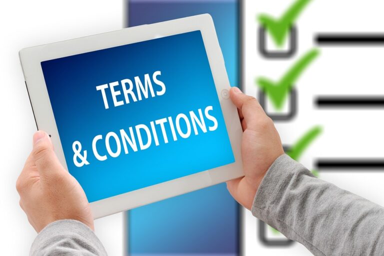 Hands holding a tablet with the screen displaying 'TERMS & CONDITIONS' and a checklist in the background showing that this page is all about terms of service.