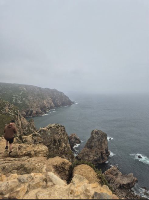 Rocky coastline in fog.
