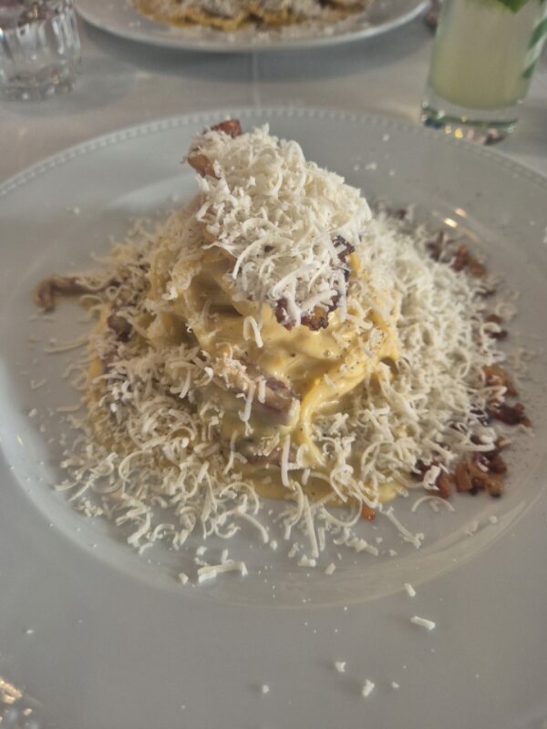 Carbonara pasta with parmesan cheese at Il Mercato in Lisbon. The best of Lisbon restaurants.