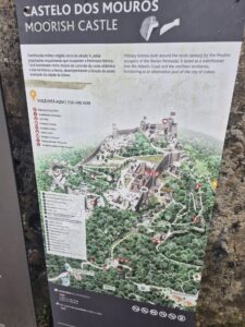 Informational map and guide board for the Moorish Castle in Sintra, showing pathways, landmarks, and historical details.