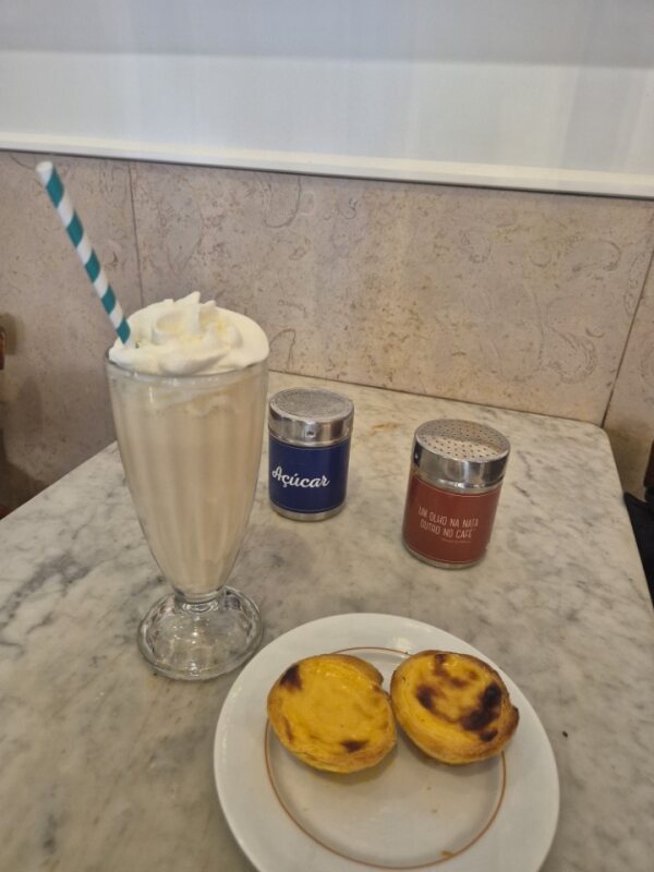 Pastel de nata milkshake with pastries at Fábrica da Nata in Lisbon.