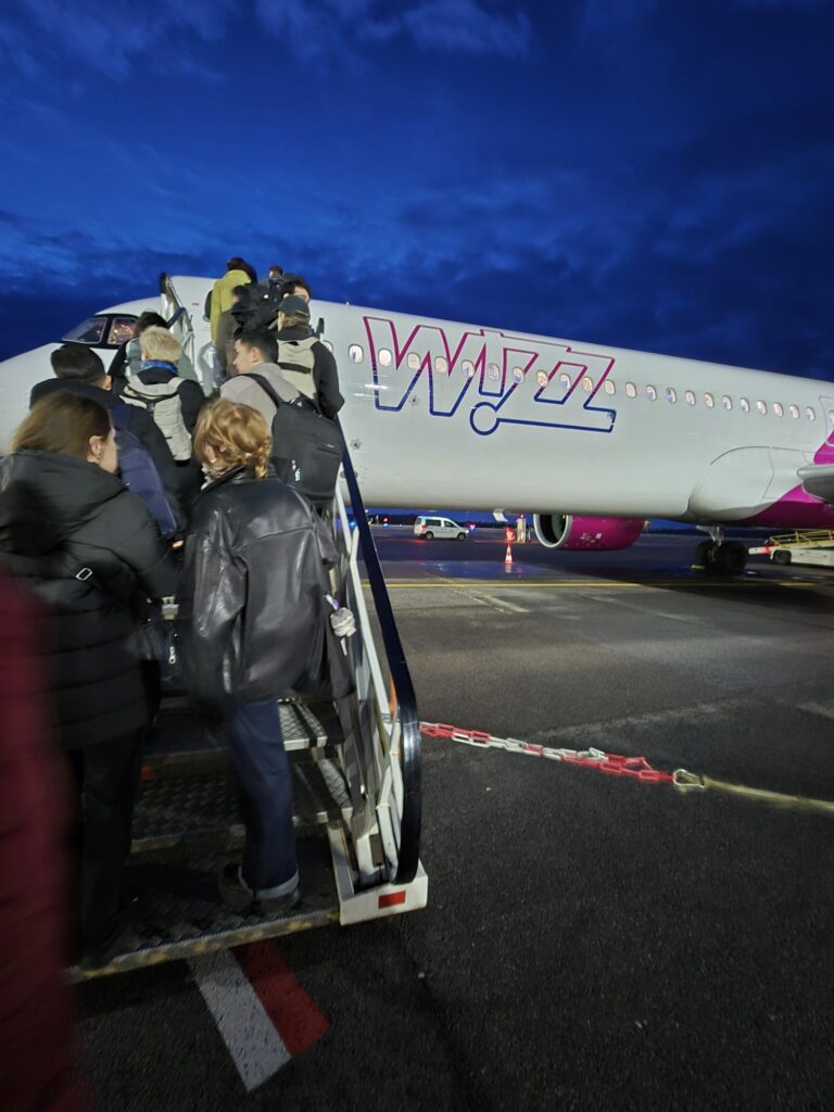 Passengers boarding a Wizz Air aircraft, capturing the start of our Wizz Air travel experience for first‑time passengers
