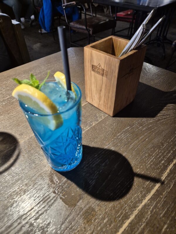 Blue cocktail drink served at Grill London restaurant in Vilnius