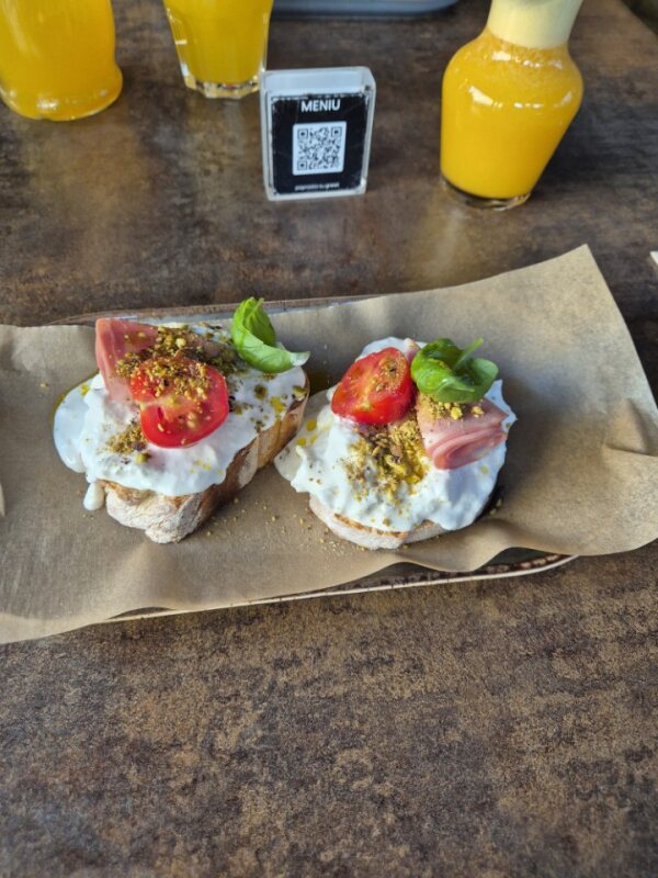 Italian-style appetizer with burrata and prosciutto in Vilnius