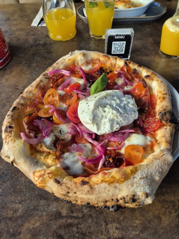 Authentic Italian pizza with burrata and pickled onions at Užupio Picerija in Vilnius