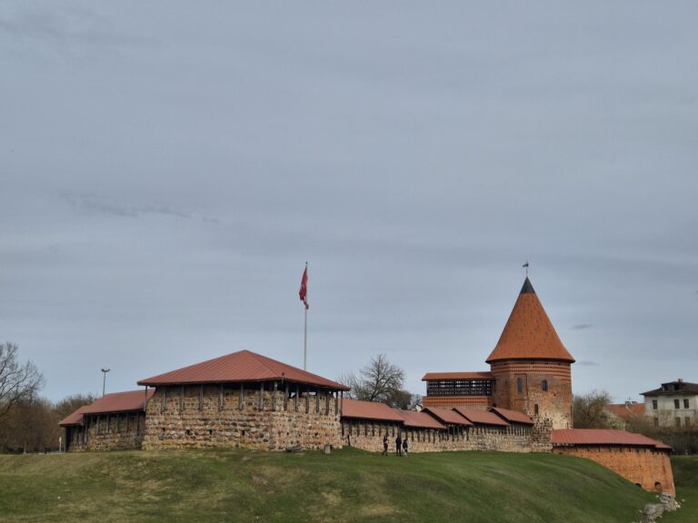 Wide view of Kaunas Castle and its grounds during a Kaunas day trip from Vilnius.